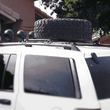 Load image into Gallery viewer, Jeep Grand Cherokee WJ Roof Mounted Tire Carrier Free US Shipping