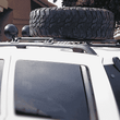 Load image into Gallery viewer, Jeep Grand Cherokee WJ Roof Mounted Tire Carrier Free US Shipping